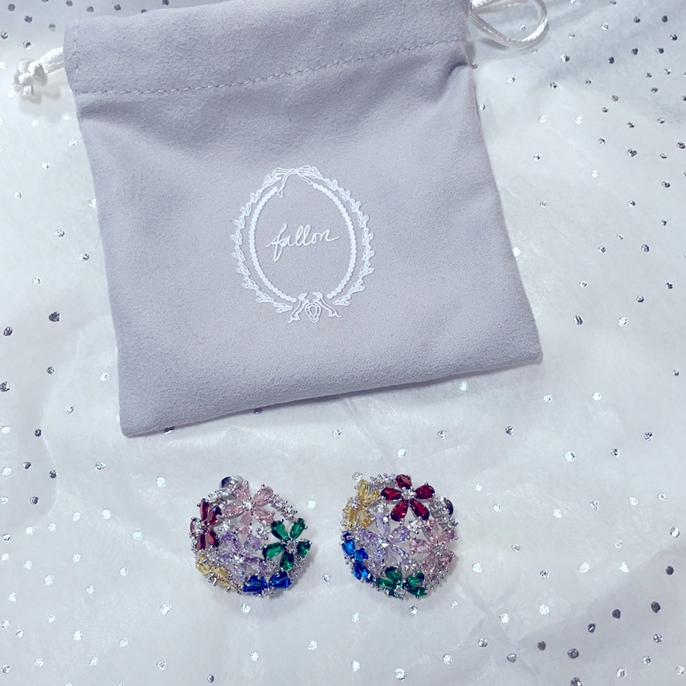 Lovely dome shaped earrings with multi colored glittering cubic zirconia stones.